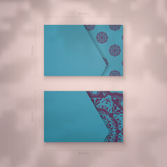 Business card in turquoise with Greek purple pattern for your personality.