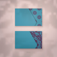 Business card template in turquoise color with a luxurious purple pattern for your personality.