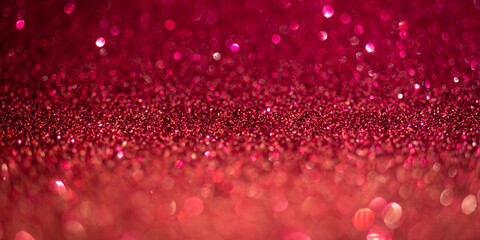 Magenta glitter lights. Shiny sparkles, bokeh effects, glowing surface. Selective focus, christmas abstract banner, background