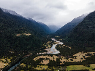 Fototapeta na wymiar Aerial view of the Cochamo valley with its snow-capped mountains and its characteristic river.