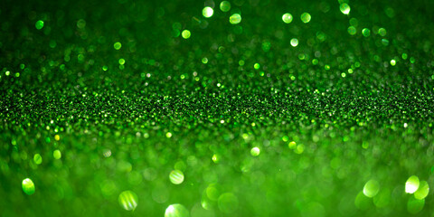 Dark green glitter lights. Shiny sparkles, bokeh effects, glowing surface. Selective focus,...