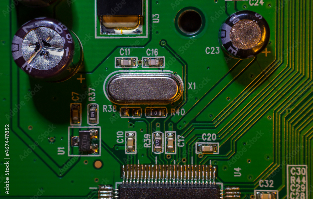 Wall mural a close-up macro shot of a quartz resonator for controlling a computer (cpu), a quartz clock on an e