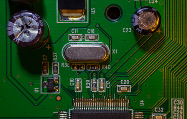 A close-up macro shot of a quartz resonator for controlling a computer (CPU), a quartz clock on an...