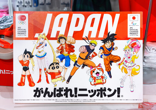tokyo, japan - september 21 2021: Cardboard on a stall of an Olympics Store depicting Japanese manga or anime characters Astro Boy, Sailor Moon, Luffy, Naruto, Son Goku, with slogan Go for it Japan.