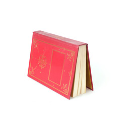 Book in red cover with white sheets isolated on a white background