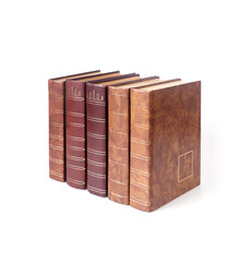 Stack of books in colour covers with white sheets isolated on a white background
