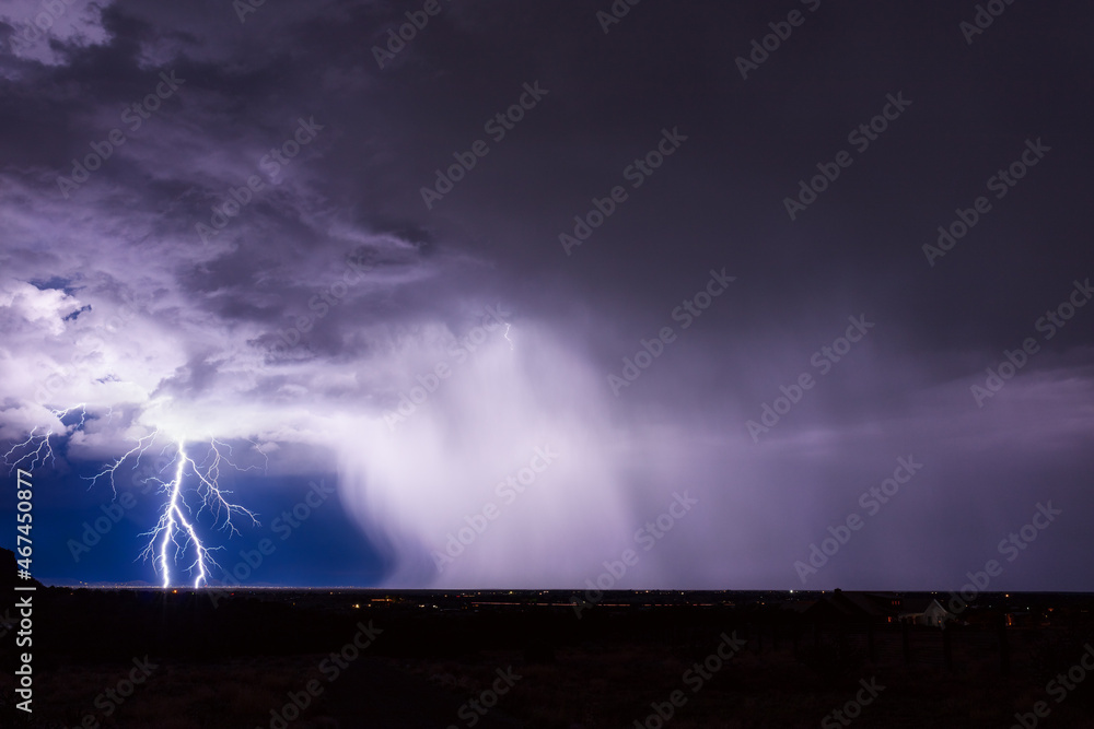 Wall mural Lightning storm over the city in Santa Fe, New Mexico