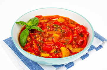 Vegetable dish of stewed sweet peppers and tomatoes, lecho, vegetarian menu. Studio Photo.
