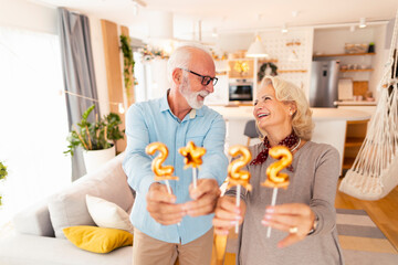 Senior couple celebrating New Year at home