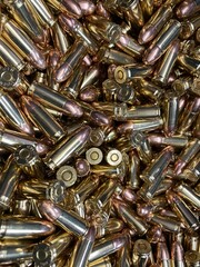 Close up of a pile of 9 mm bullets