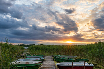 Boats in the bay during the sunset.