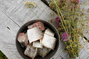 Cooking pike fish soup. Cooking food on a tourist burner. Traditional food angler or tourist. 