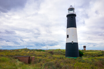 Fototapeta na wymiar Landscape on Spurn tidal island showing Spurn Point Lighthouse