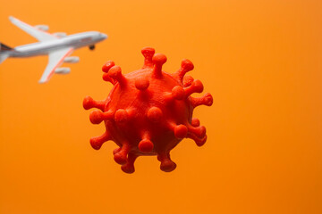 A molecule of the COVID-19 virus and a flying passenger plane in the background.