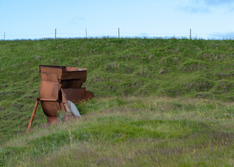 Landscape of metal rusty farm equipment near Reynisfjara Black sand Beach Vik South Iceland