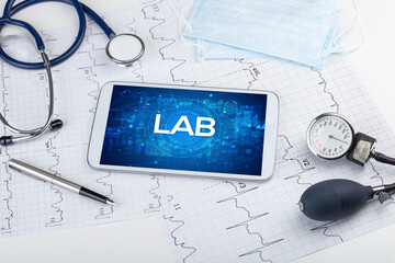 Close-up view of a tablet pc with medical abbreviation