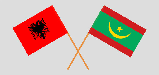 Crossed flags of Albania and Mauritania. Official colors. Correct proportion