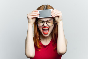 pretty woman in glasses with phone in hands communication technology