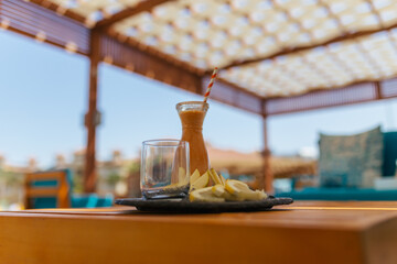 Glasses with fresh organic fruit juices on the table