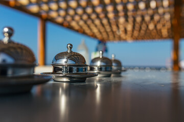 closeup ouydoor hotel reception bells