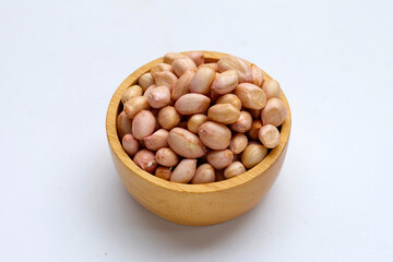 Raw peanuts on white background.