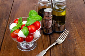 Caprese salad in glass. Studio Photo.