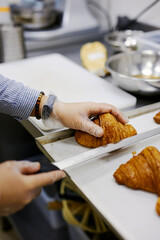 pastry chef makes croissant filling for breakfast