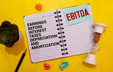 Notepad with inscriptions EBITDA - Earnings Before Interest, Taxes, Depreciation and Amortization