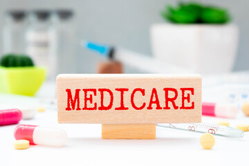 Word writing text Medicare. Business concept for Federal health insurance for people above