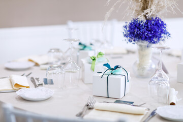 wedding bomboniere at a banquet, boxes with ribbons