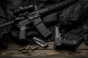 Modern automatic rifle with a telescopic sight on a dark background. Jacket, cap, gloves on a wooden table. The uniform of a guard or a mercenary