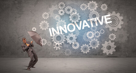 Obraz premium Businessman defending with umbrella concept