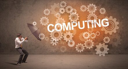 Businessman defending with umbrella concept