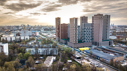 Naklejka na ściany i meble panorama from a drone on a residential area of Moscow. new high-rise buildings against the background of old low houses. general plan