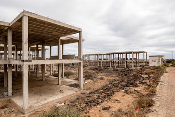 Abandoned builtings skeletons in the fuerteventura beach