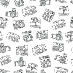 Seamless pattern with vintage cameras. Black illustration on a white background. 