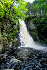 Flowing water from a water fall in a unique perspective, long exposure.