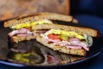 Egg sandwich on bread in natural light .