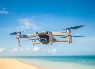 A drone quad copters with high resolution digital camera flying aerial over a beautiful tropical beach. 
