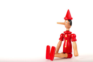 The concept of lies. Pinocchio's nose. Dishonest person caught being dishonest. Corruption, fake...