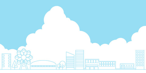 都会の街並みと入道雲