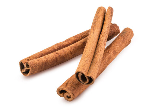 Cinnamon sticks. Dried cinnamon stick. Aromatic spices for Drink, cooking or baking. Isolated white background. Macro High resolution photo. Professional food photography. Close-up Full depth of field