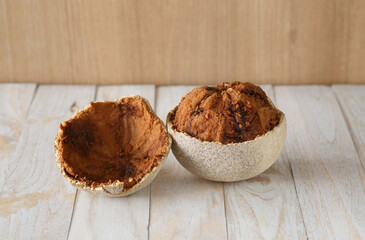 Wood Apple on a white wooden table