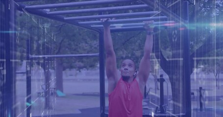 Animation of lights and data processing over male athlete exercising on monkey bars outdoors - Powered by Adobe