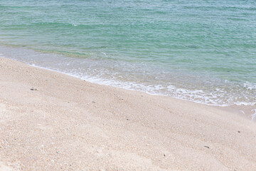 Fototapeta na wymiar Soft wave of the sea on the sandy beach 