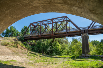 Old iron rusty bridge over a Putah Creek in Winters CA.