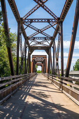 Old iron rusty bridge over a Putah Creek in Winters CA.