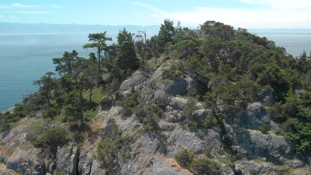 A aerial drone shot of the beautiful coastline with turquoise water near Sooke, BC. 4K 24FPS.