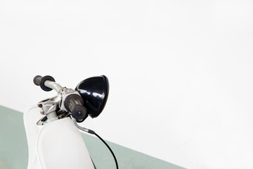 Close-up view on retro motorcycle headlights on white background