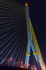 Obraz premium The Rama VIII Bridge is a cable-stayed bridge crossing the Chao Phraya River in Bangkok, Thailand.